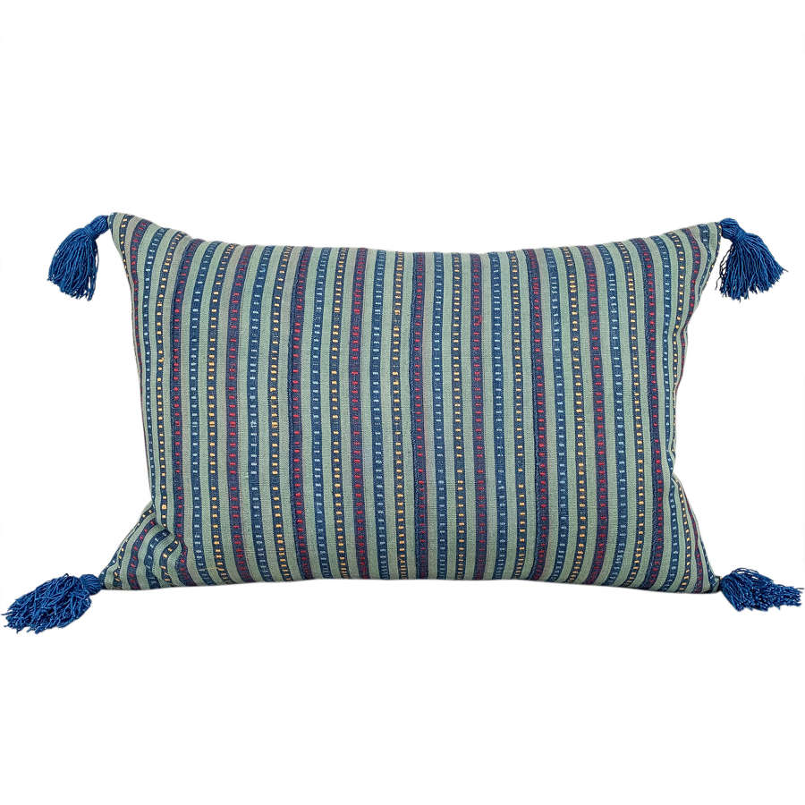 Green Ewe cushion with blue tassels