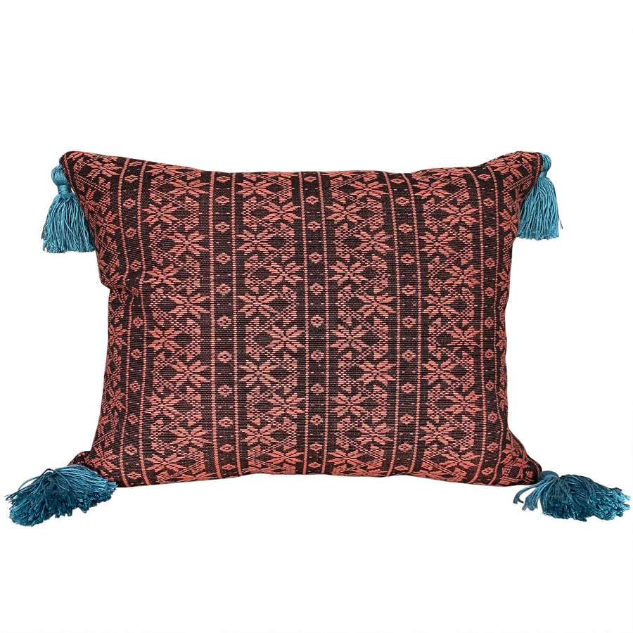Naga cushion with teal tassels