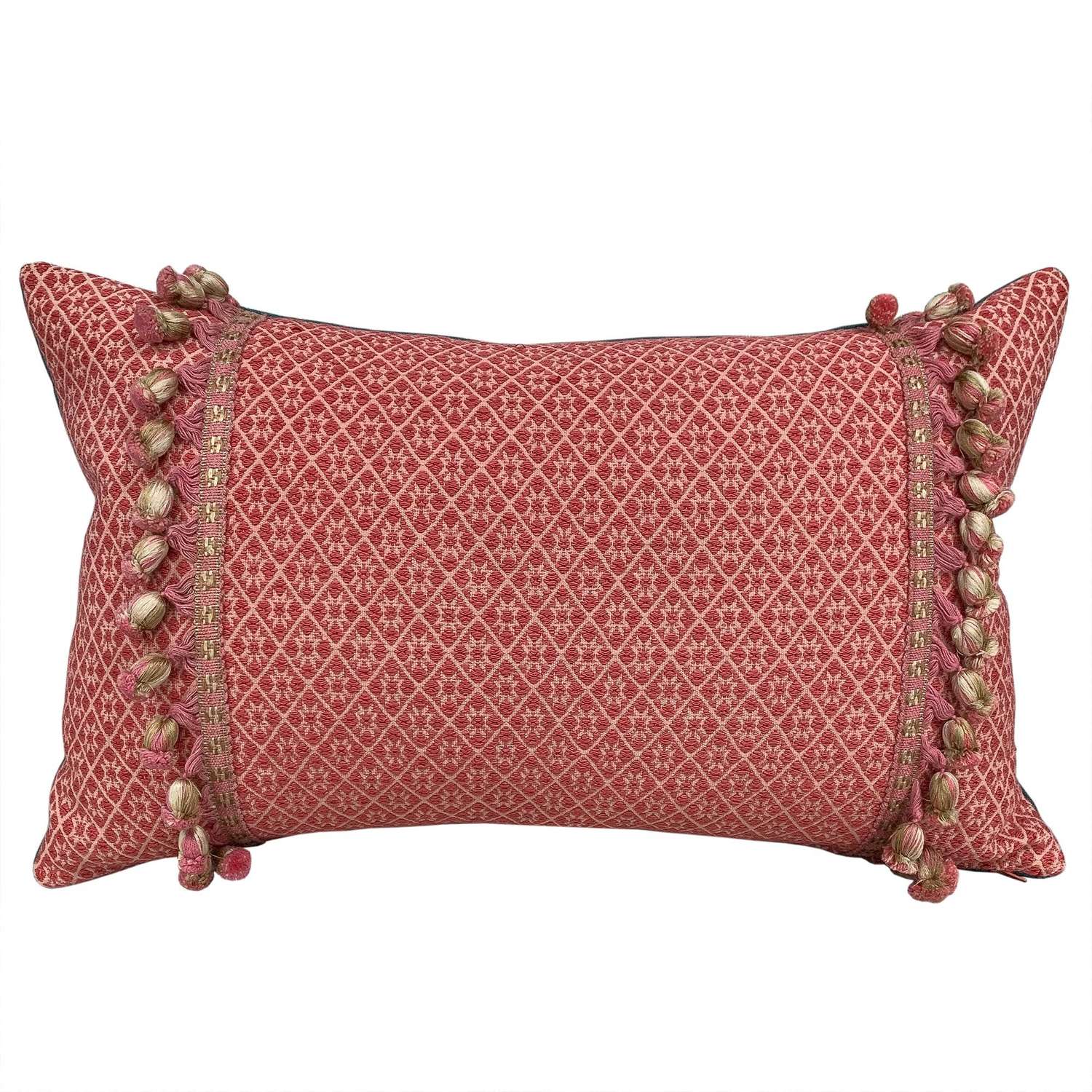 Coral Zhuang cushions with bobble trim