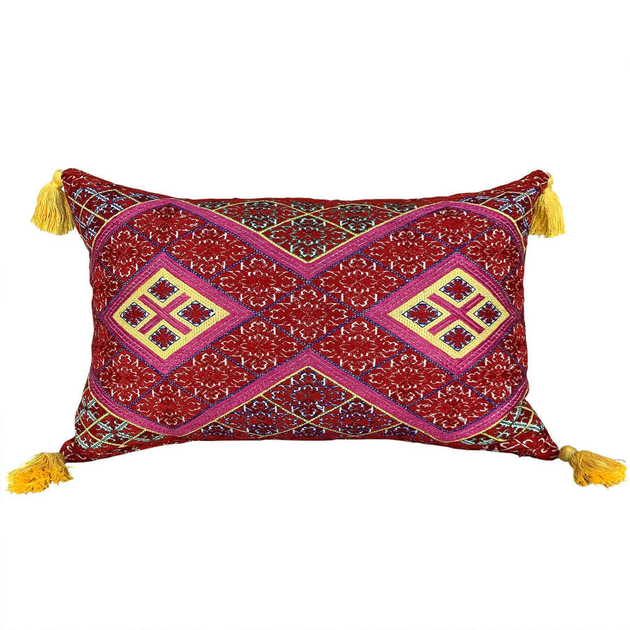 Swat cushion with yellow tassels