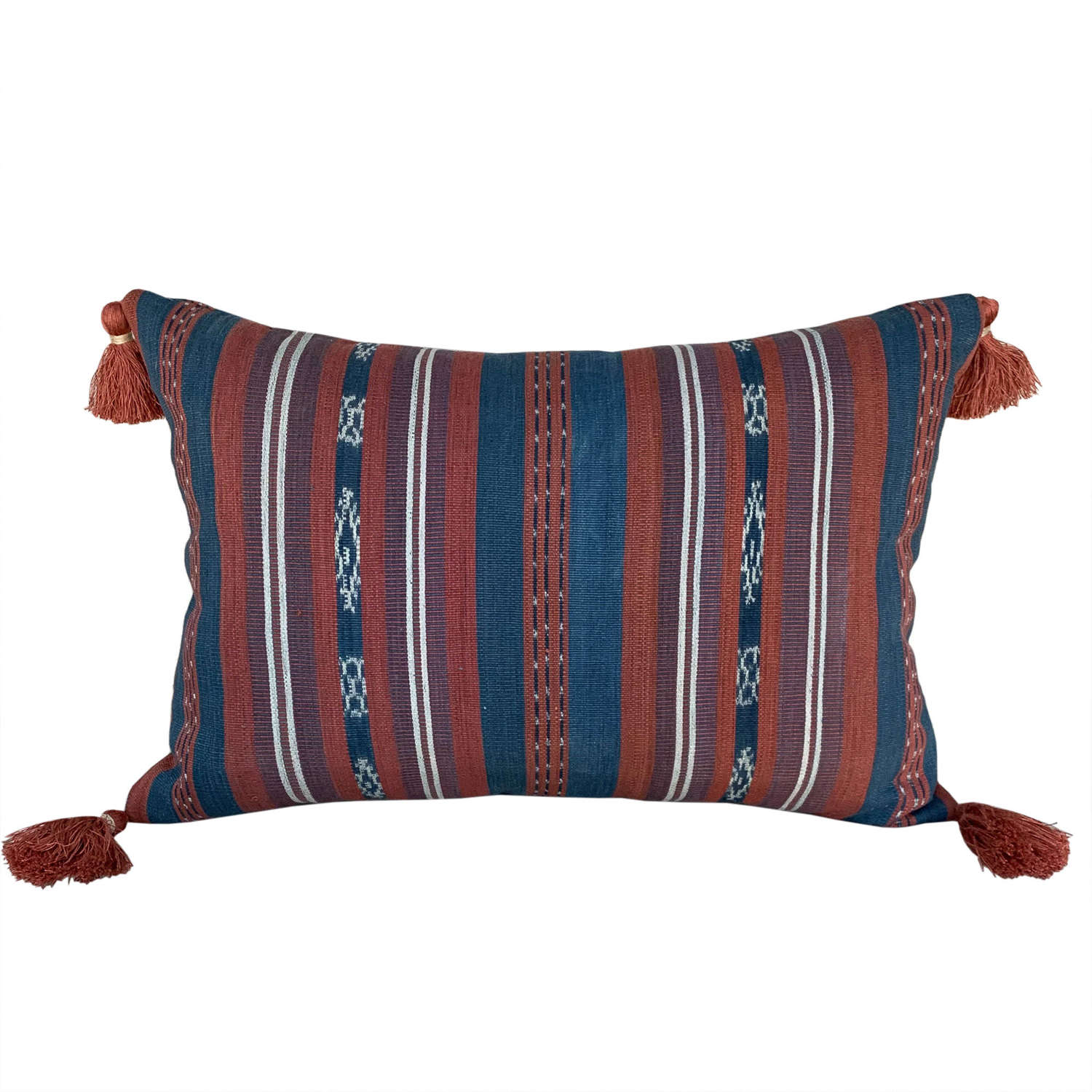 Flores Sikka cushions with rust tasssels