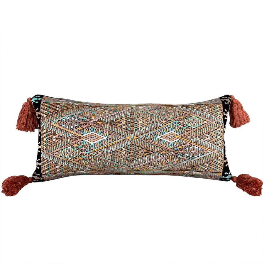 Huipil cushion with coral tassels