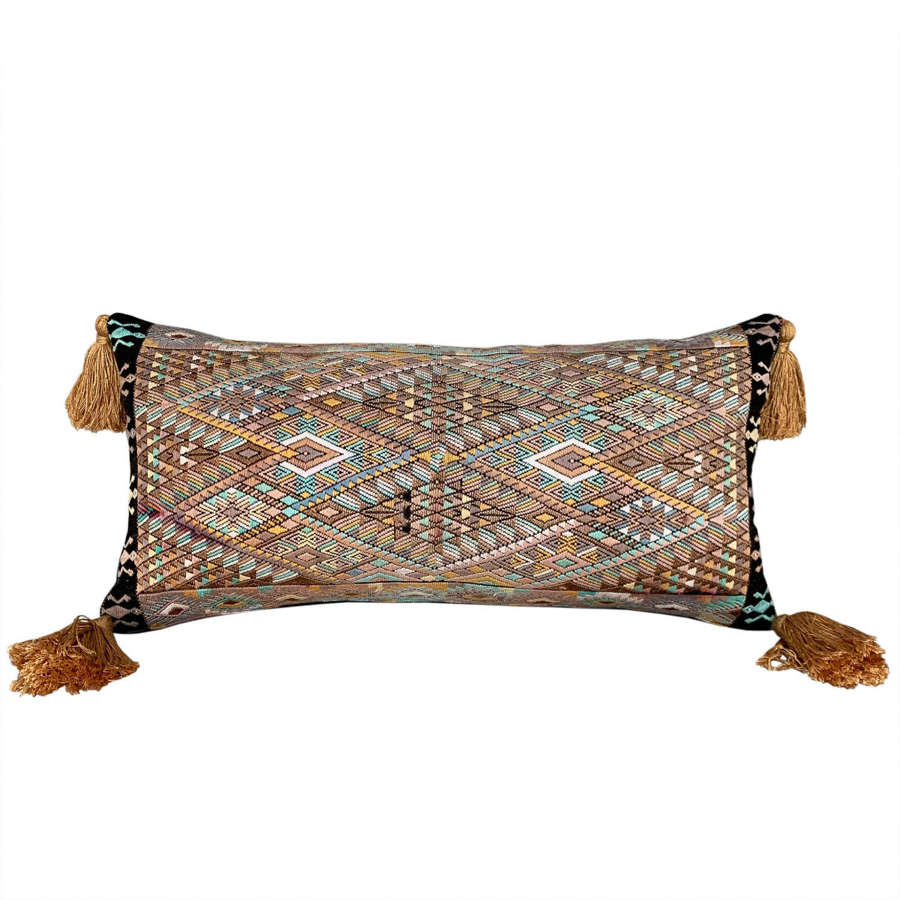 Huipil cushion with gold tassels